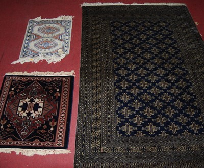 Lot 1098 - A Persian woollen blue ground Bokhara rug,...