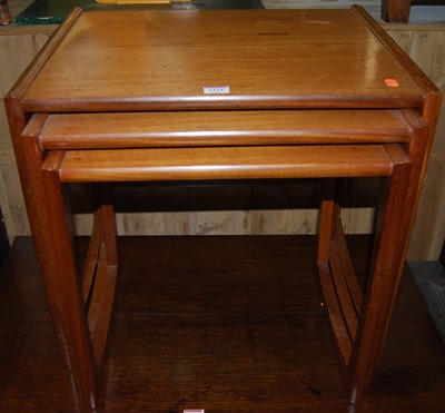 Lot 1124 - A 1970s G-Plan teak nest of three occasional...