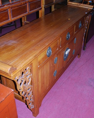 Lot 1145 - A Chinese elm sideboard, having three frieze...