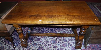 Lot 1190 - A 17th century style joined oak plank top...