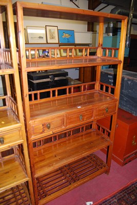 Lot 1159 - A Chinese stained pine freestanding display...