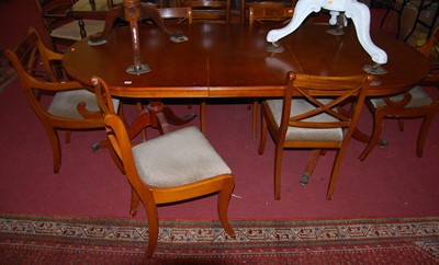 Lot 1170 - A reproduction yew wood dining suite,...