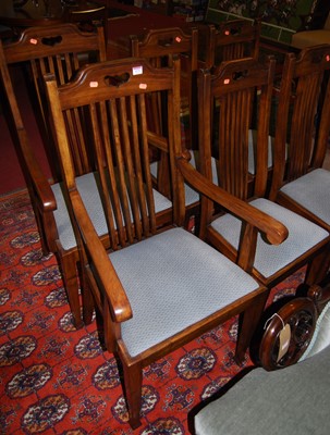 Lot 1171 - A set of six Edwardian walnut slatback dining...