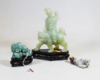 Lot 164 - A reproduction Chinese faux jade figure carved...