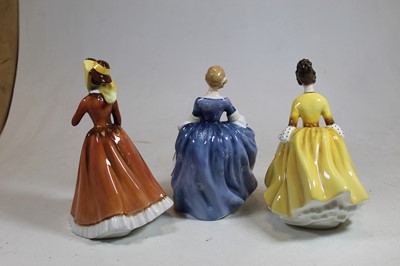 Lot 168 - Three Royal Doulton figurines, comprising...