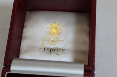 Lot 195 - A modern Asprey's silver napkin ring, in...
