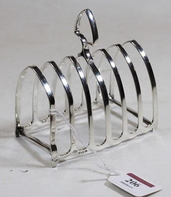 Lot 206 - A George V silver six-division toast rack, 4.9oz