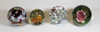 Lot 214 - A collection of four modern glass paperweights