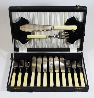Lot 215 - A cased set of fish knives and forks, six...
