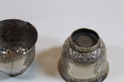 Lot 244 - A pair of Eastern white metal cups, each...