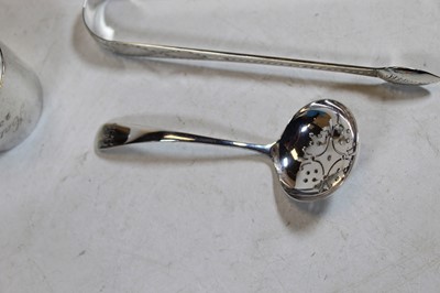 Lot 263 - A modern silver sifting spoon; together with a...