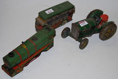 Lot 1232 - A 20th century tinplate tractor; a 20th...