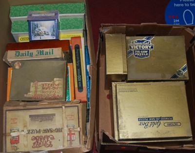 Lot 1256 - Two boxes containing a quantity of jigsaws...