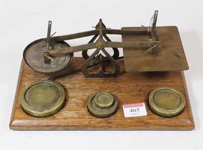 Lot 403 - A set of brass Post Office scales and weights,...