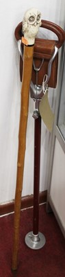 Lot 412 - A shooting stick; together with a walking...