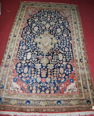 Lot 1198 - A Persian woollen blue ground rug, having a...