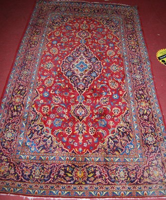 Lot 1199 - A Persian woollen Tabriz rug, having a red...