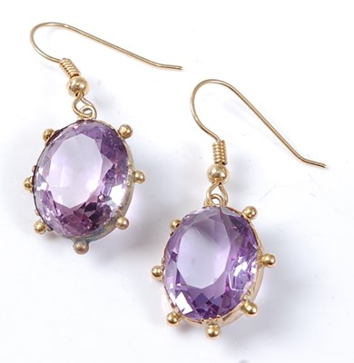 Lot 2534 - A pair of yellow metal oval amethyst drop...