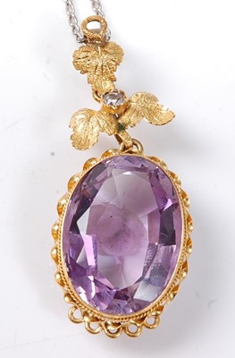 Lot 2526 - A yellow metal Etruscan style amethyst pendant,...