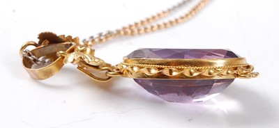 Lot 2526 - A yellow metal Etruscan style amethyst pendant,...
