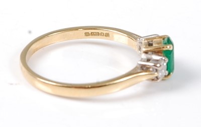 Lot 2522 - An 18ct yellow and white gold, emerald and...