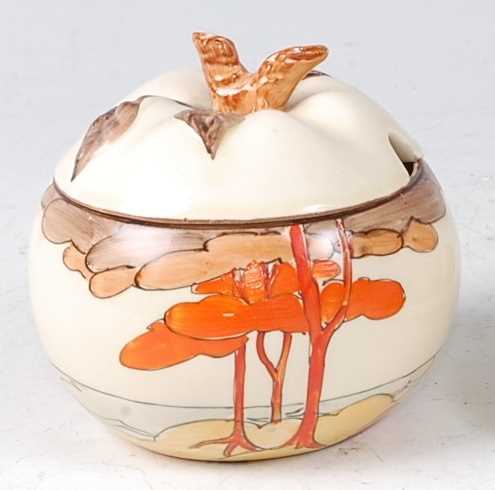 Lot 1 - A Clarice Cliff pottery preserve pot and cover,...