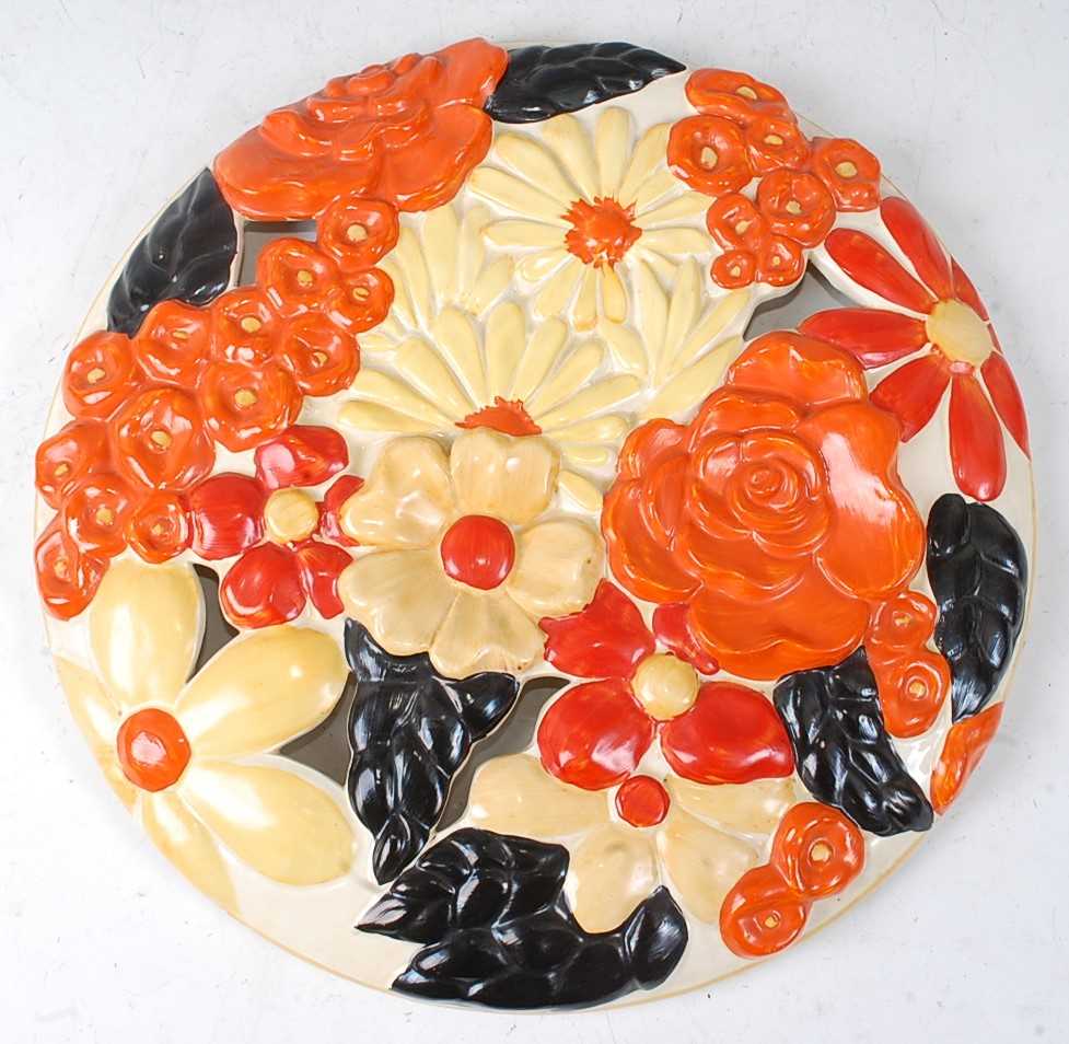 Lot 8 - A Clarice Cliff pottery circular wall charger,...