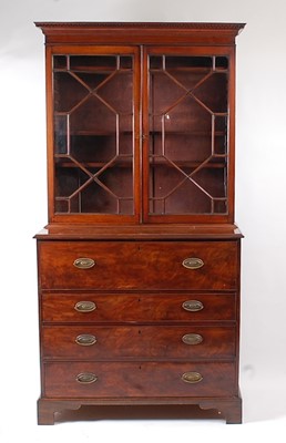 Lot 1401 - A George III mahogany secretaire bookcase, the...