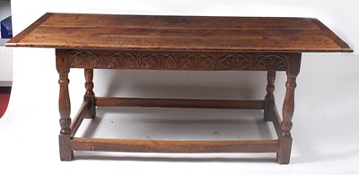 Lot 1402 - An antique oak refectory table, having a...