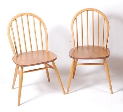 Lot 386 - A pair of Ercol Windsor light elm stickback...