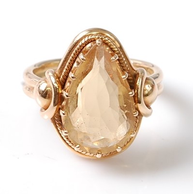 Lot 1181 - A yellow metal citrine dress ring, featuring a...