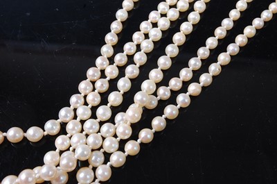 Lot 1216 - A three-row pearl necklace, comprising 73, 83,...
