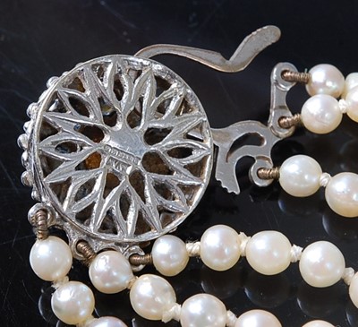 Lot 1216 - A three-row pearl necklace, comprising 73, 83,...