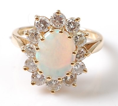 Lot 1176 - An 18ct yellow and white gold, opal and...