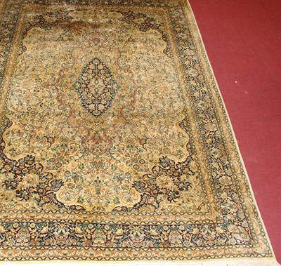 Lot 1359 - A Persian woollen Kashmir rug, the cream...