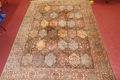 Lot 1362 - A Persian woollen green ground carpet,...