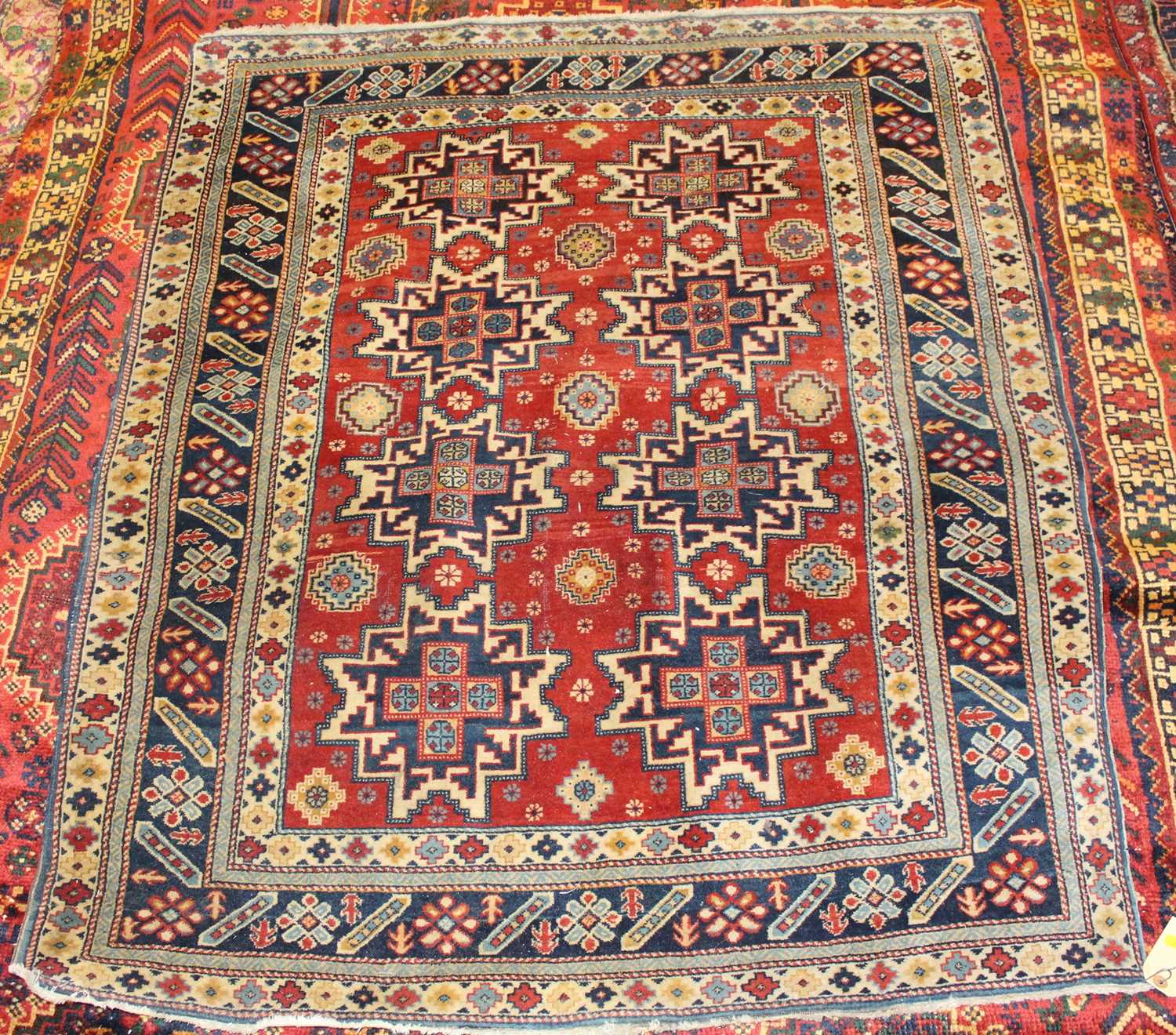 Lot 1 - * A Turkish woollen rug, the red ground...