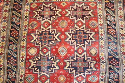 Lot 1 - * A Turkish woollen rug, the red ground...