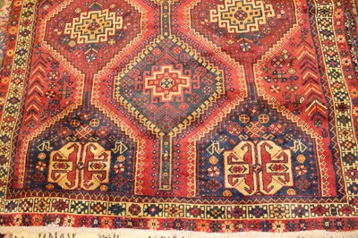 Lot 2 - * An Afghan woollen Shirvan rug, the red...