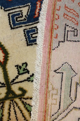 Lot 3 - * A Caucasian woollen rug, the cream ground...