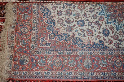 Lot 6 - * A Persian woollen Tabriz rug, the cream...