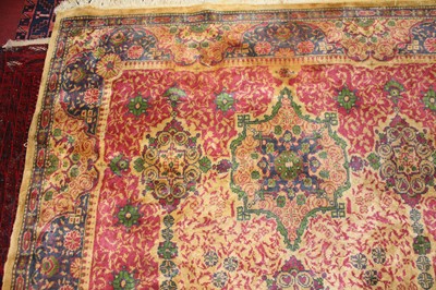 Lot 11 - * An Indo-Persian woollen rug, the beige...