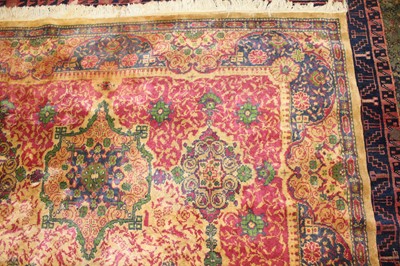Lot 11 - * An Indo-Persian woollen rug, the beige...