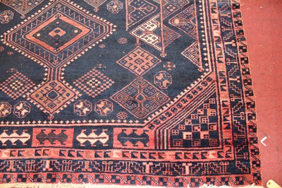 Lot 12 - * A Turkish woollen rug, the blue ground...