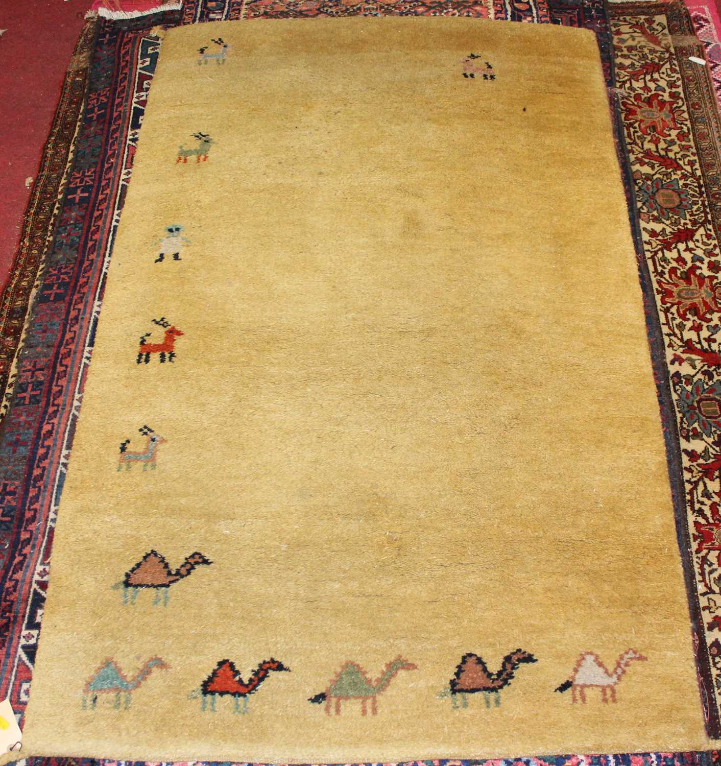 Lot 15 - * An Afghan woollen rug, having a deep pile,...