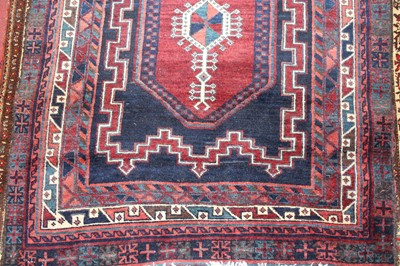 Lot 18 - * A Persian woollen Kazak rug, the deep blue...