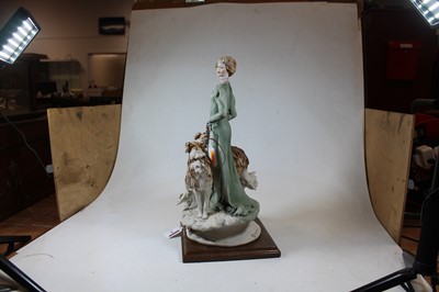 Lot 4 - An Italian bisque figure of a Lady with two...
