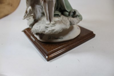 Lot 4 - An Italian bisque figure of a Lady with two...