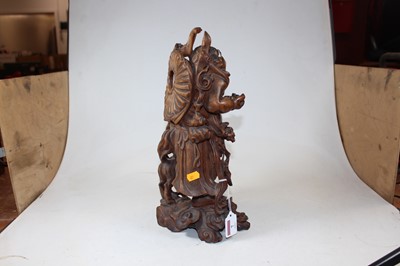 Lot 7 - An early 20th century carved wood figure of a...