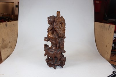 Lot 7 - An early 20th century carved wood figure of a...